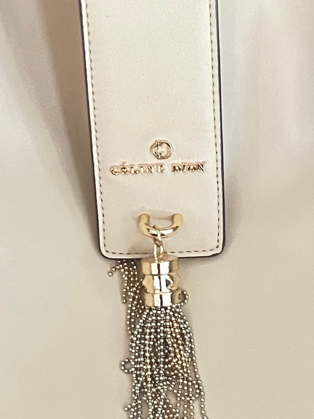 Celinne Dion Cream Shoulder Bag with Gold Tassel